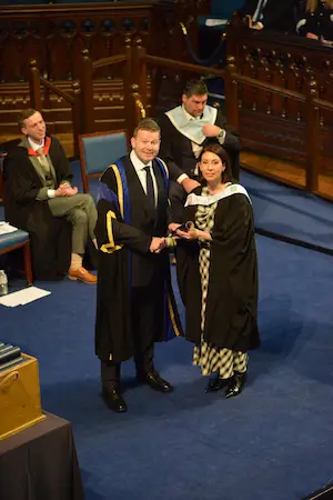 Marie Hall Receiving Diploma